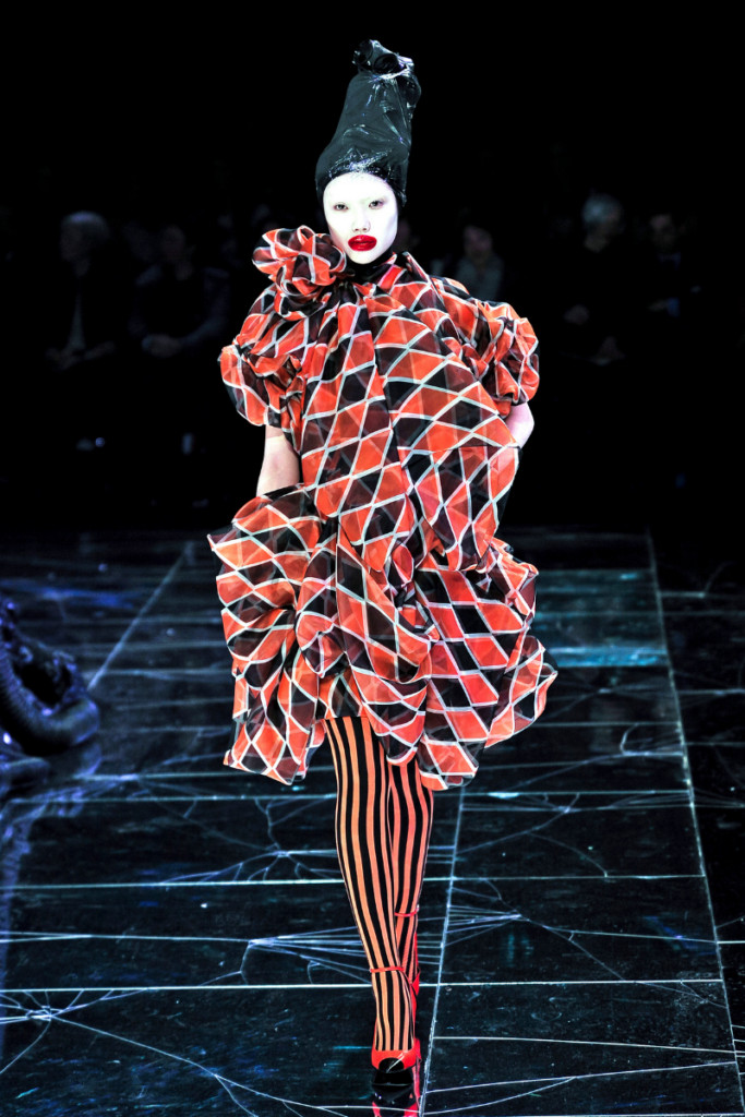 Sara Camposarcone embracing the clowncore aesthetic with bright colors and bold makeup
