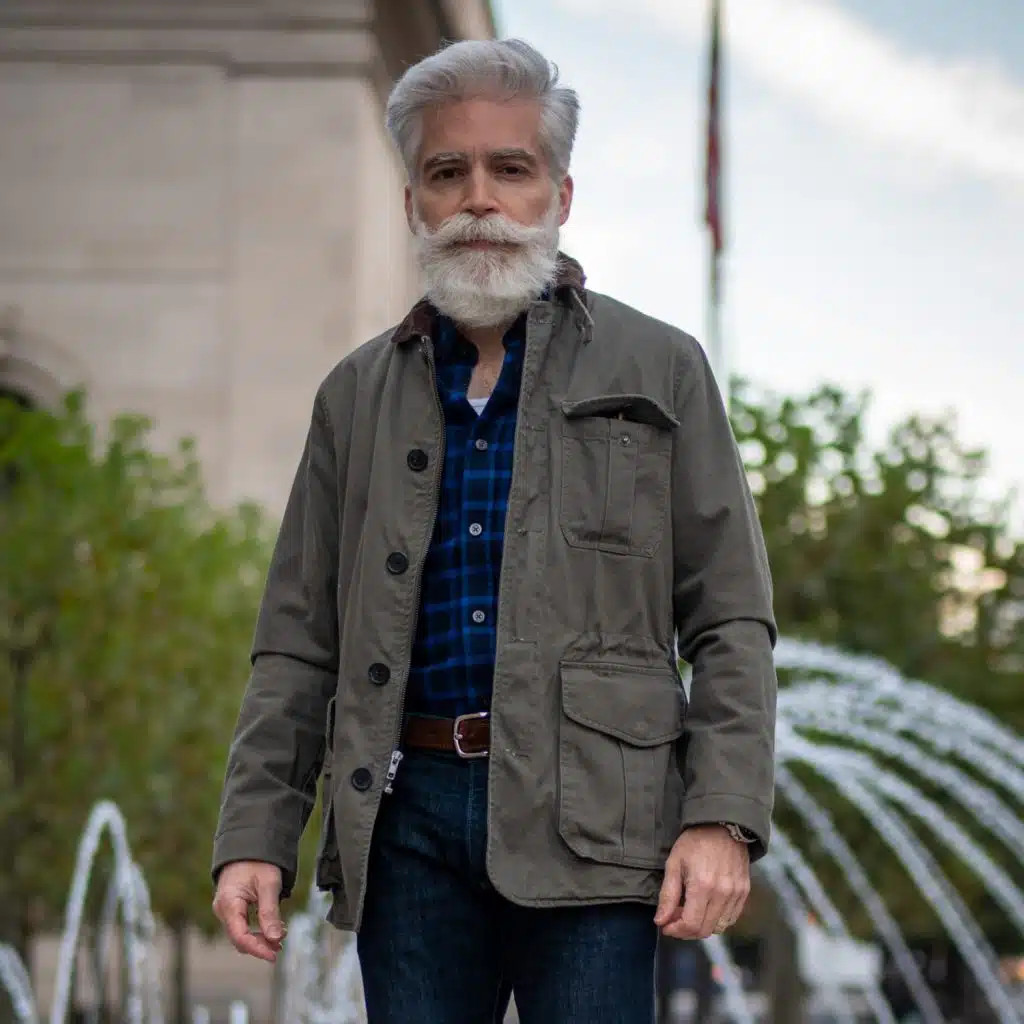 Man wearing a denim jacket and boots, showcasing Americana style
