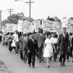 NAACP members marching for integration in 1964, showcasing the era's emphasis on respectable attire with suits and ties