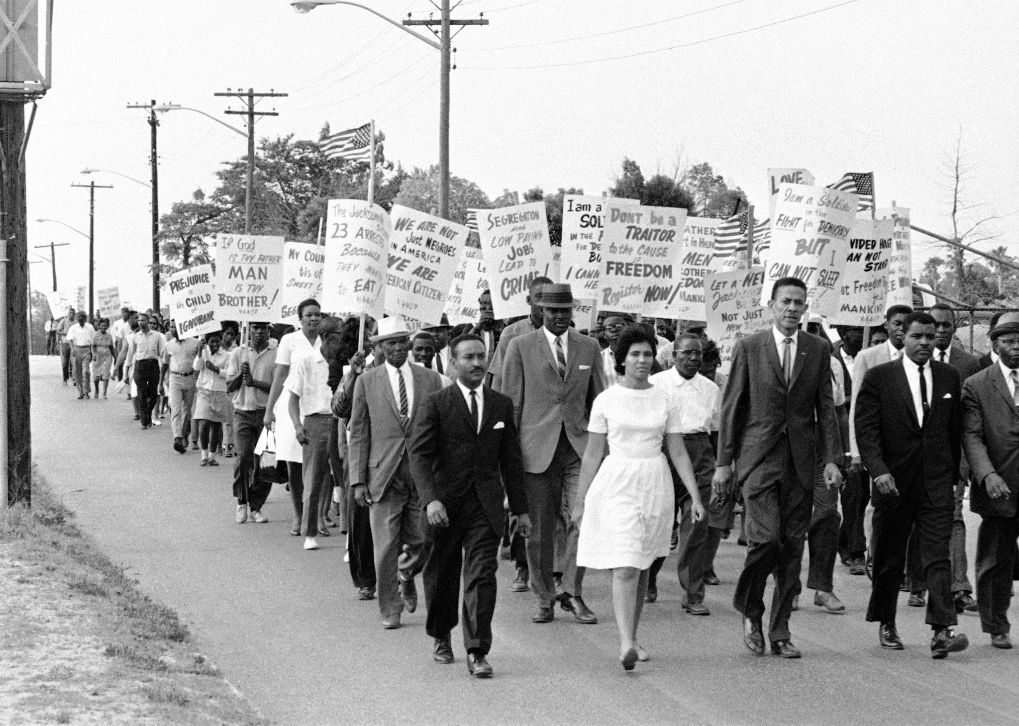 NAACP members marching for integration in 1964, showcasing the era's emphasis on respectable attire with suits and ties