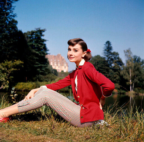 Audrey Hepburn's gamine haircut in a black and white photo, showcasing her stylish and sophisticated appearance