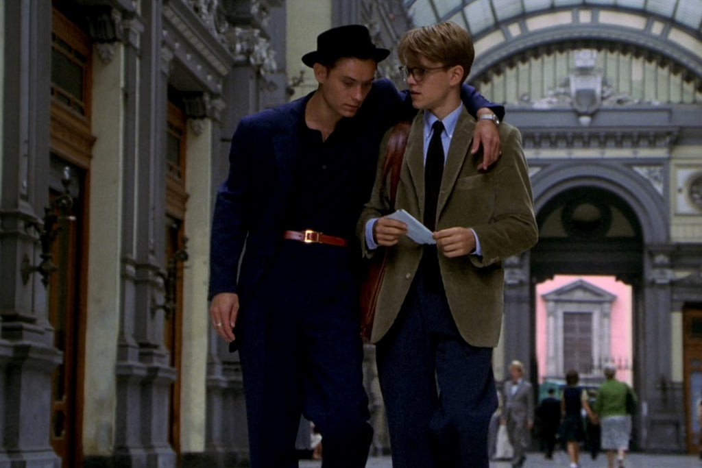 Dickie Greenleaf wearing a navy suit in The Talented Mr Ripley, highlighting the detailed costume design