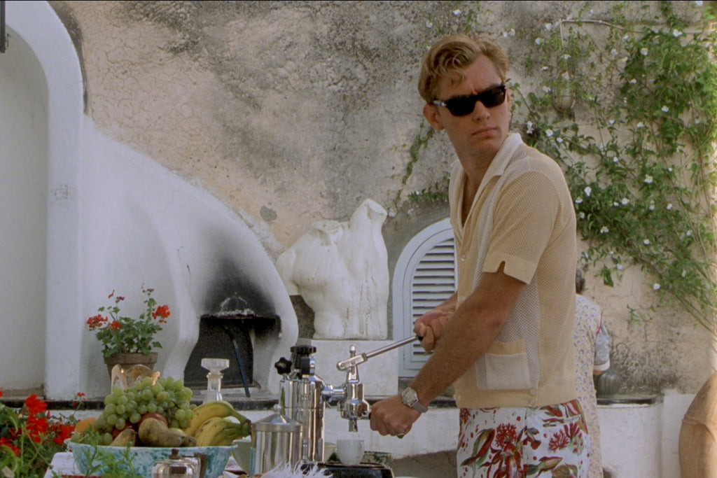 Jude Law as Dickie Greenleaf, showcasing his Riviera chic style in a variety of outfits.