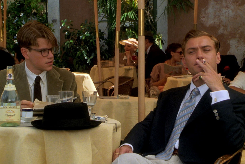 Jude Law as Dickie Greenleaf in The Talented Mr Ripley, showcasing the navy dupioni silk jacket