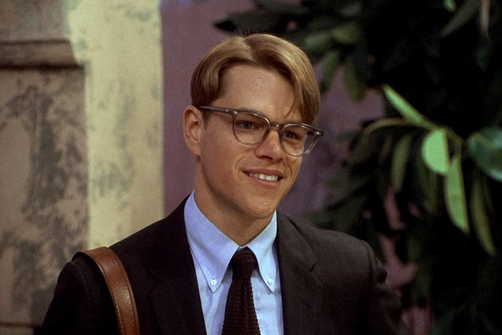 Tom Ripley wearing an OCBD and knitted tie in The Talented Mr Ripley, demonstrating his classic, understated style