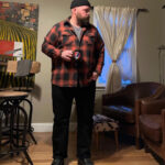 Casual weekend winter outfit with a knit sweater, jeans, and boots