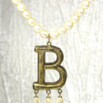 Betty's signature "B" necklace