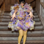 Cardi B attends the Marc Jacobs Fall 2024 Runway show, showcasing her unique style with a vibrant floral ensemble