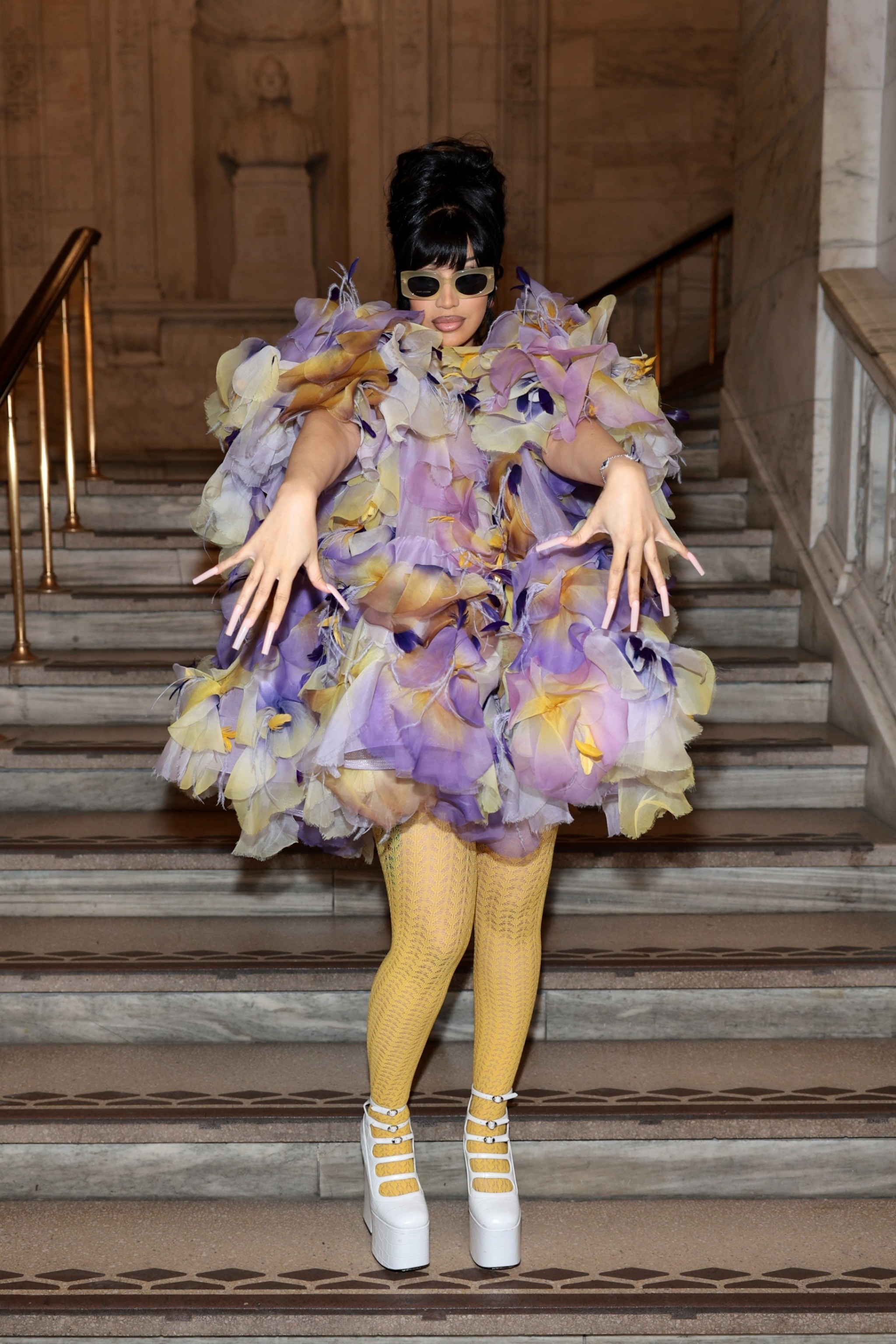 Cardi B attends the Marc Jacobs Fall 2024 Runway show, showcasing her unique style with a vibrant floral ensemble