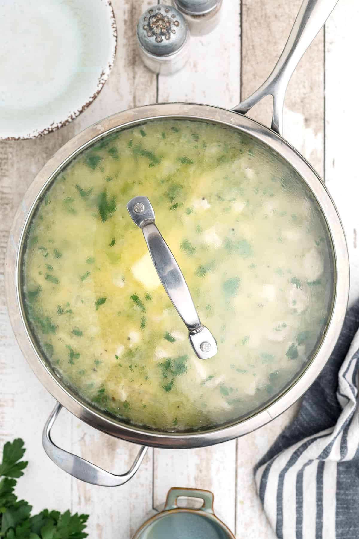 Chicken and rice prepared in a cooking pan.