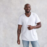 Man with white shirt and jeans on