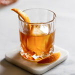 Cuban Old Fashioned Cocktail with Orange Peel Garnish