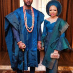 Man in a richly embroidered Agbada, showcasing the prestige associated with the garment.