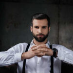 Man in gray suit and suspenders
