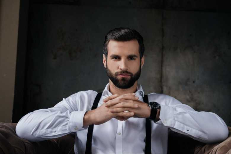 Man in gray suit and suspenders
