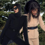 Women showcasing cinch-waist ski jackets.