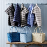 Martha Stewart wearing a puffer vest and tote bag