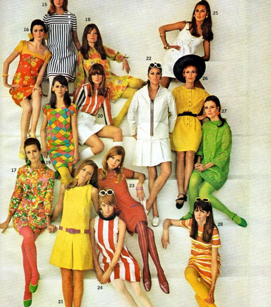 Man in a 70s-inspired disco outfit with a sequined shirt and flared pants