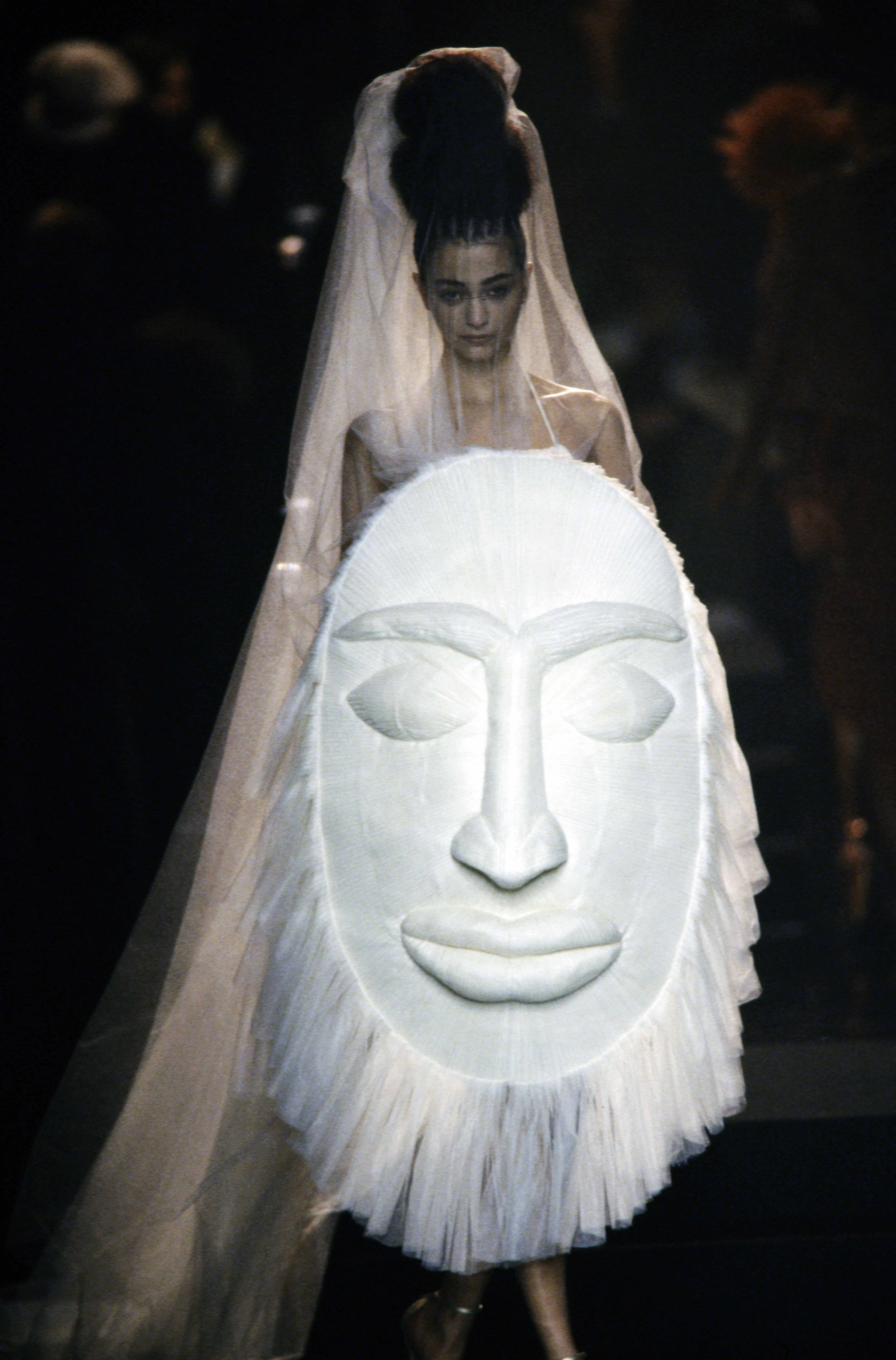 An African Tribal inspired shield-bouquet couture bridal ensemble designed by Jean Paul Gaultier for Spring 2005