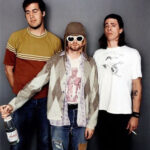 Members of Nirvana, embodying the grunge influence on 90s punk fashion