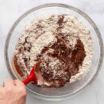 Mixing flour, cocoa, and sugar in a bowl for Hershey's Chocolate Cake.