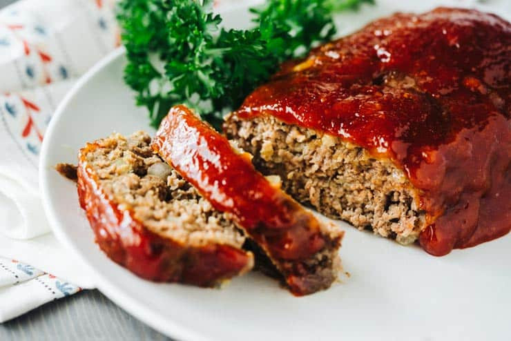 Raw meatloaf mix with crushed crackers and herbs
