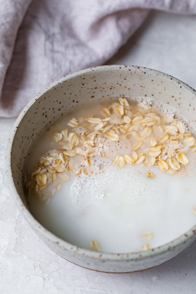 Close up of old fashioned oats cooking in a saucepan on the stovetop