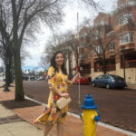 Man in a yellow floral dress