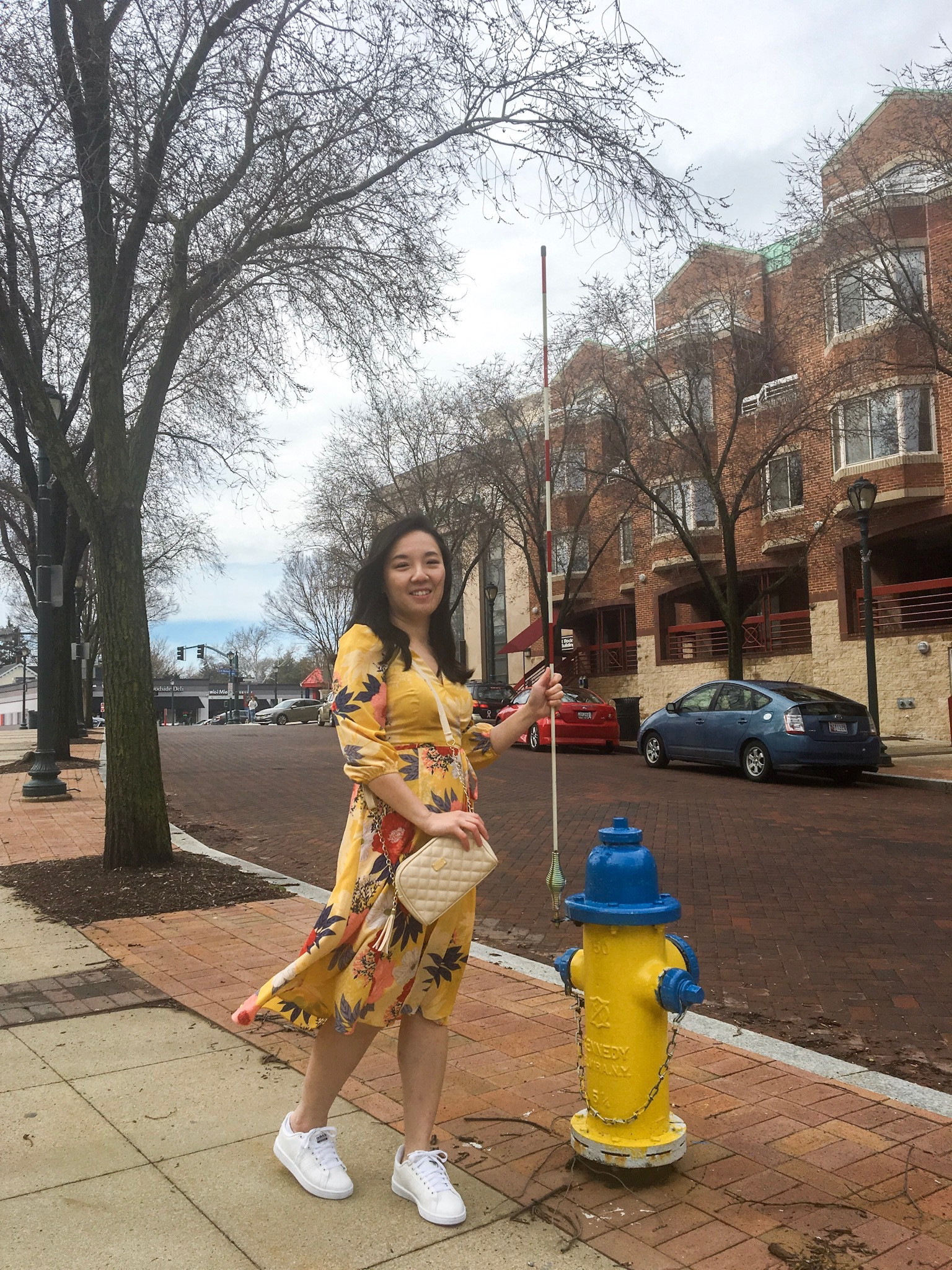 Man in a yellow floral dress