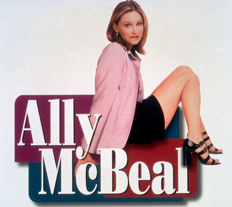 An image of Ally McBeal, showcasing her 90s office fashion style.