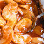Baked apple slices showcasing a golden-brown, caramelized surface, appealing to culinary enthusiasts with their rustic charm.