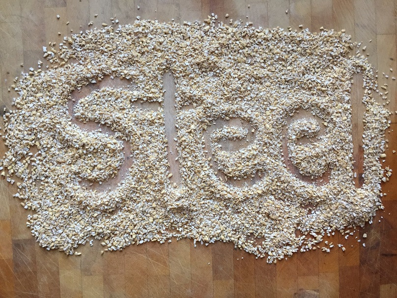 Steel cut oats in a wooden bowl