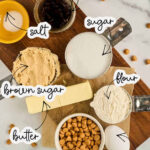 Ingredients for old fashioned butterscotch cookies including flour, butterscotch chips, brown sugar, butter, and sugar