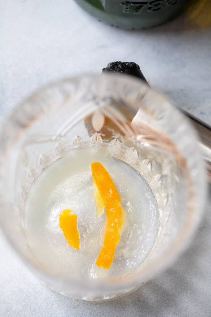 Muddling Sugar and Bitters for Irish Old Fashioned