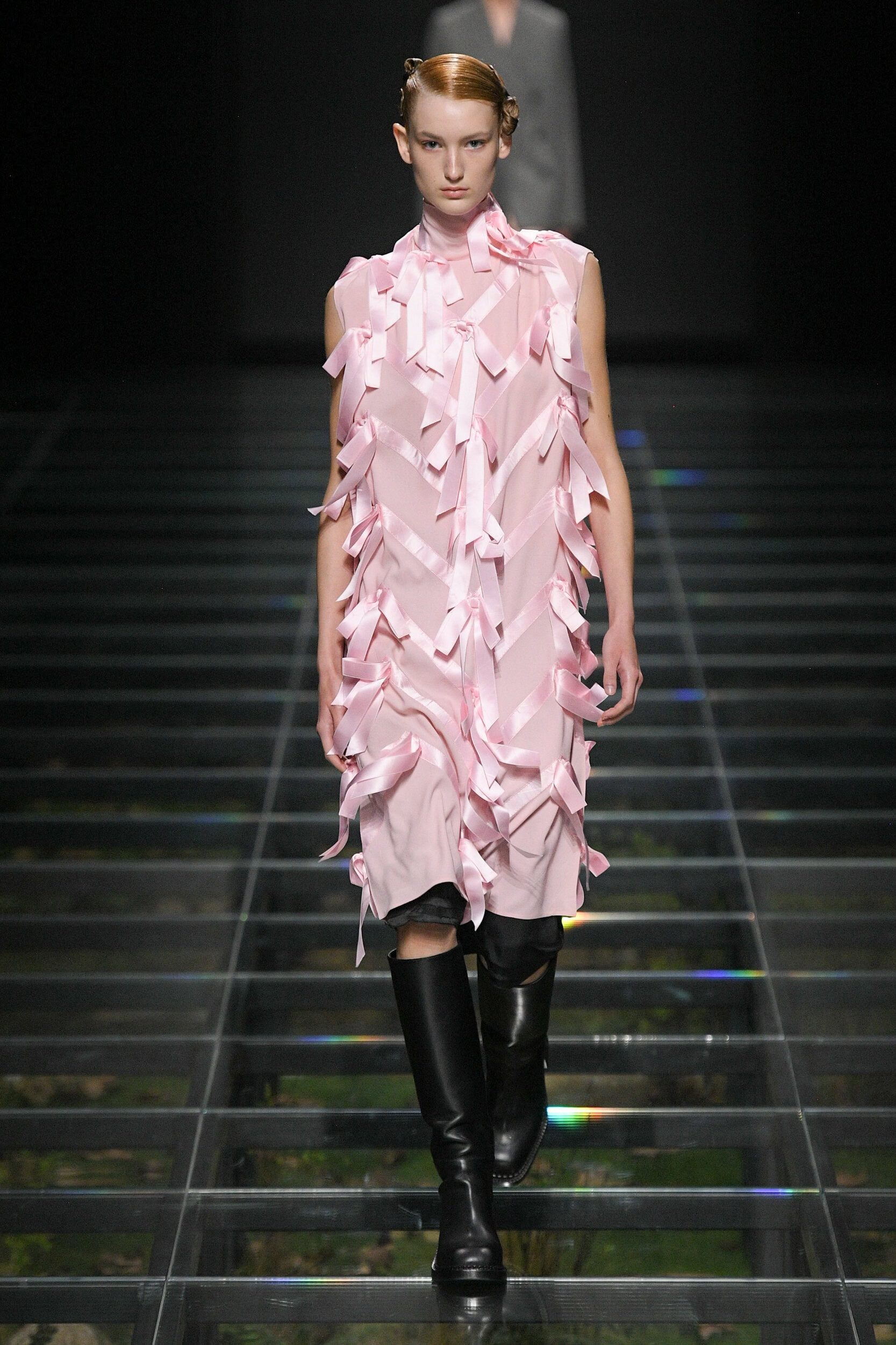 Model in Prada Fall 2024 showstopper look featuring a girly uniform