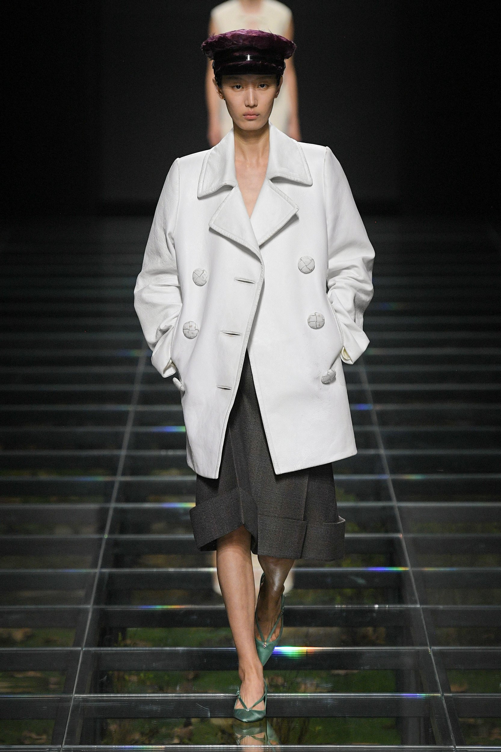 Prada Fall 2024 collection highlighting romantic elements in menswear