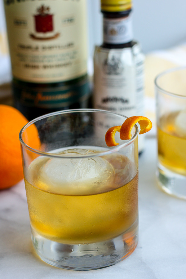 Close-up of a Jameson Orange Old Fashioned, highlighting the orange twist garnish