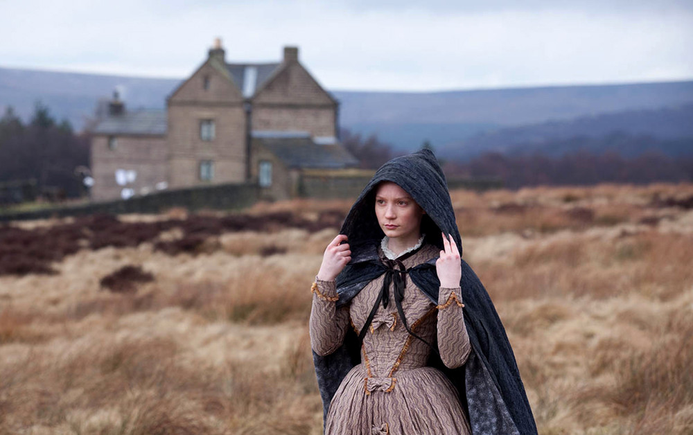 jane eyre wearing a hooded cloak