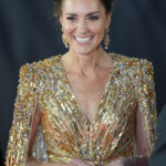 Princess Kate wearing a Jenny Packham gold sequin dress, inspired by the Goldfinger film, at the No Time To Die premiere.