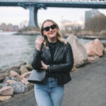 Casual Chic: Black biker jacket with a white t-shirt, skinny jeans, and sneakers