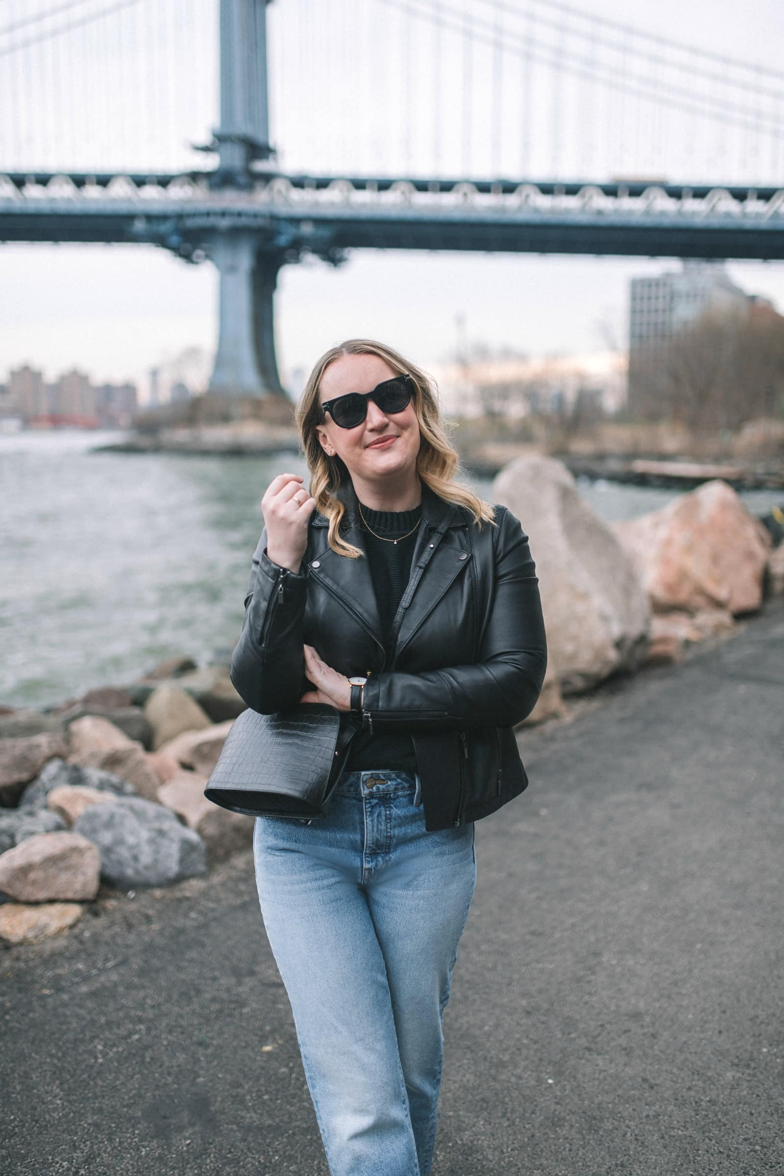 Casual Chic: Black biker jacket with a white t-shirt, skinny jeans, and sneakers