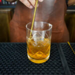 Mixing Old Fashioned Cocktail From Scratch With Ice Cubes