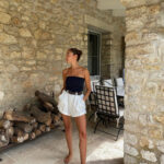 Man in linen shirt and beige shorts