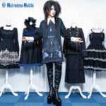 Mana-sama standing in front of 4 clothed mannequins, showcasing the Moi-même-Moitié brand's gothic elegance and aristocratic designs.