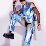 Man with sunglasses wearing a metallic blue outfit