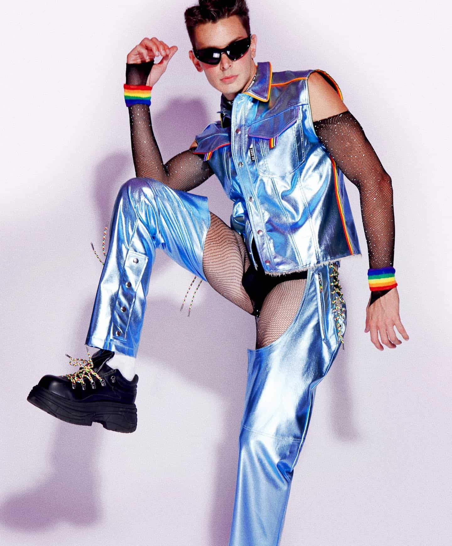Man with sunglasses wearing a metallic blue outfit