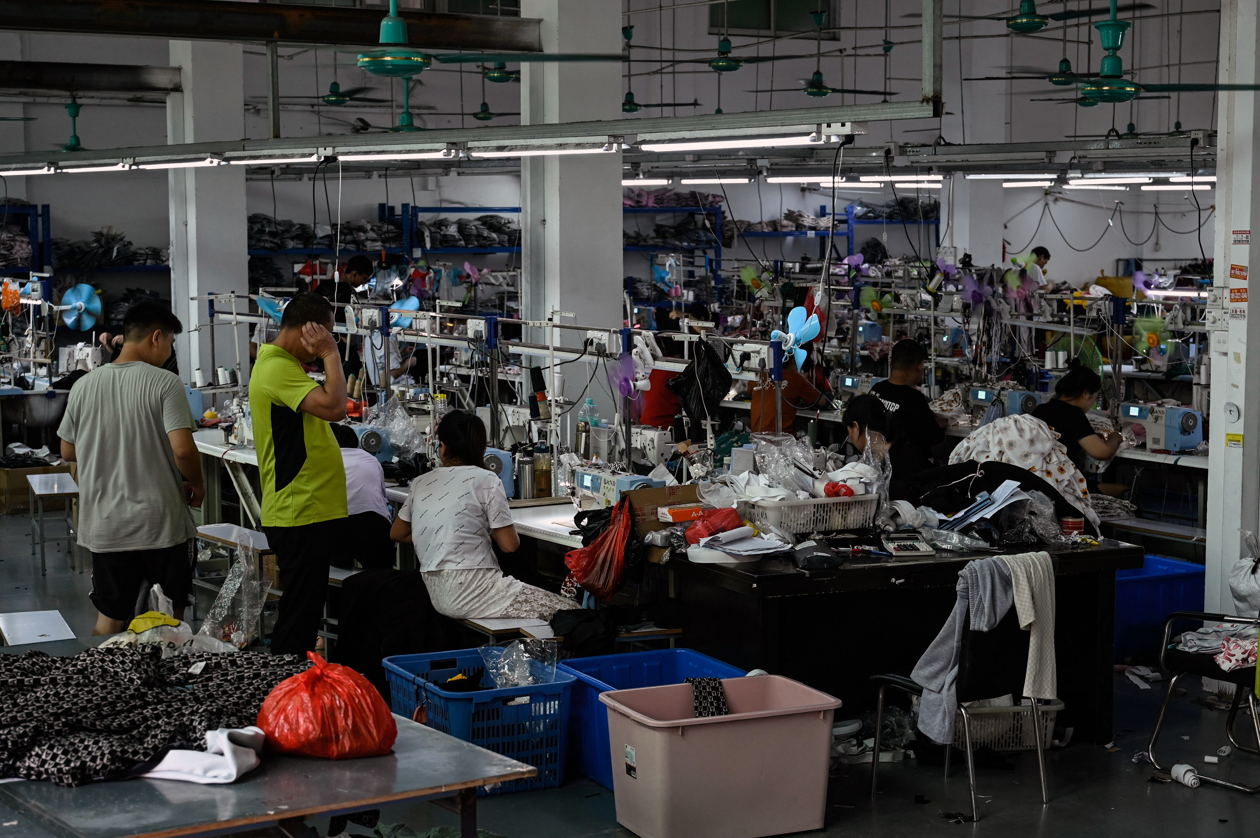Man in a factory setting, highlighting ethical concerns and sustainability in fashion production