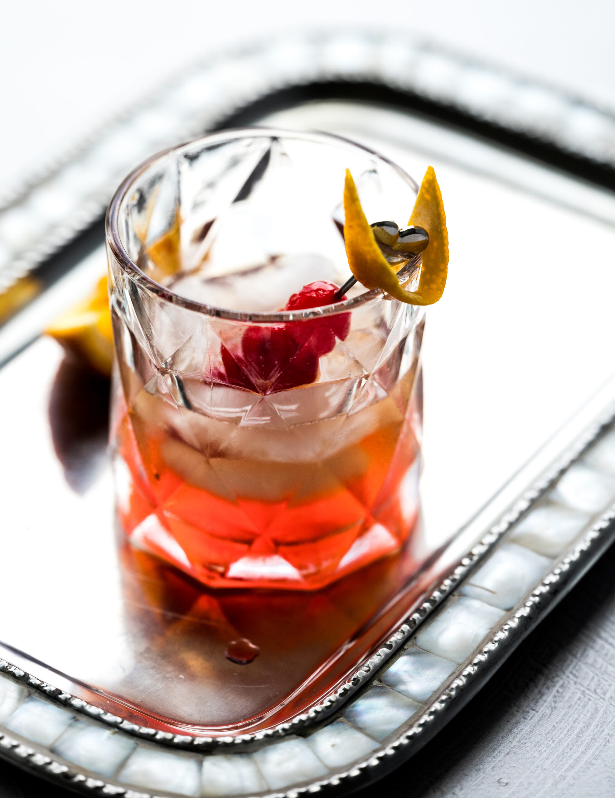 Close up shot of an old fashioned cocktail in a low ball glass.
