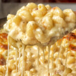 Classic dish of old fashioned baked mac and cheese with a golden crust