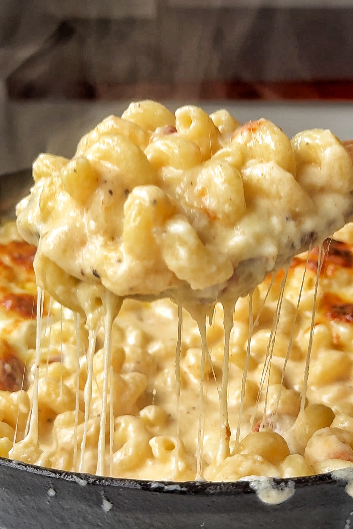 Classic dish of old fashioned baked mac and cheese with a golden crust